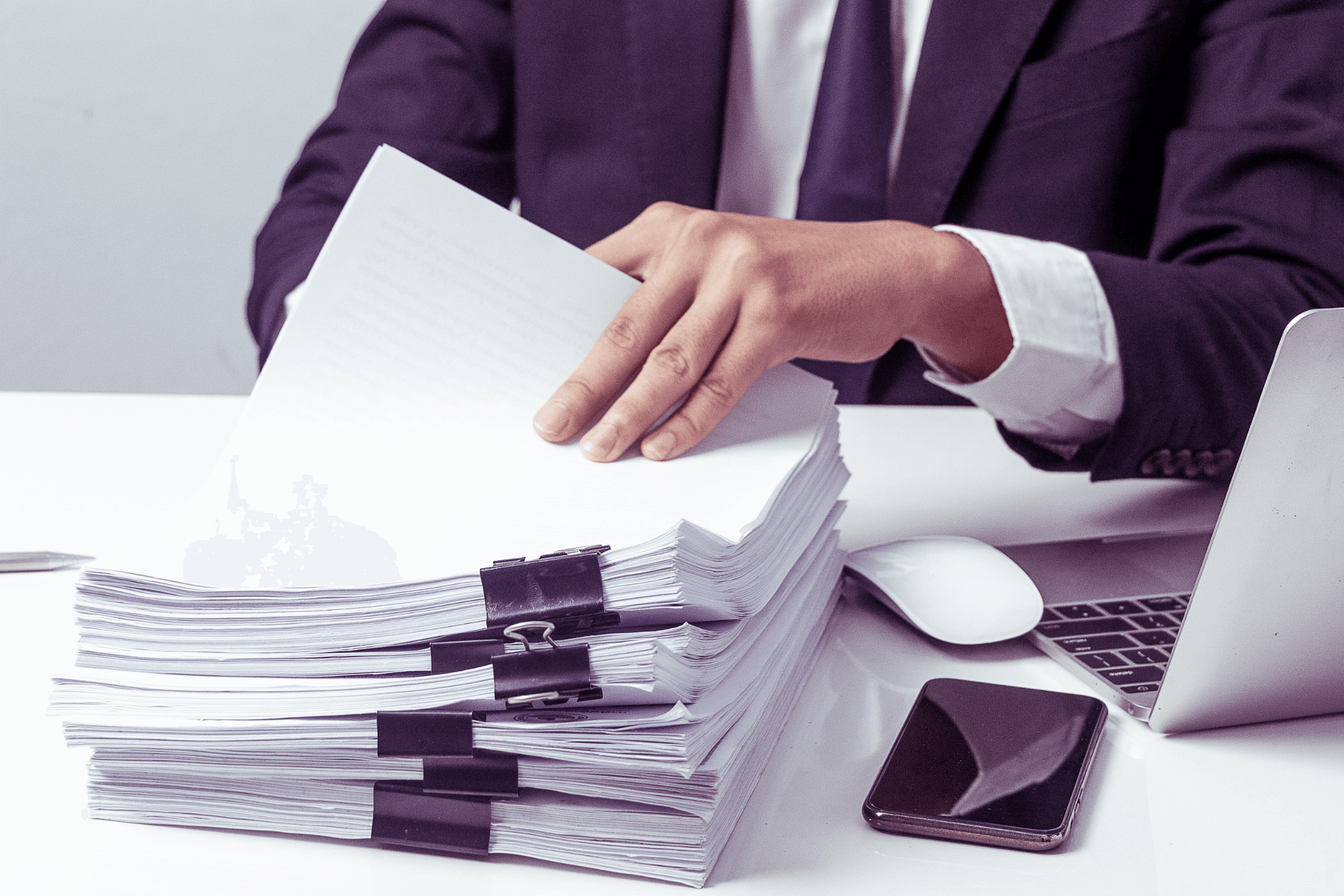 Businessmen are searching for documents lying on the table,business report papers,important documents.